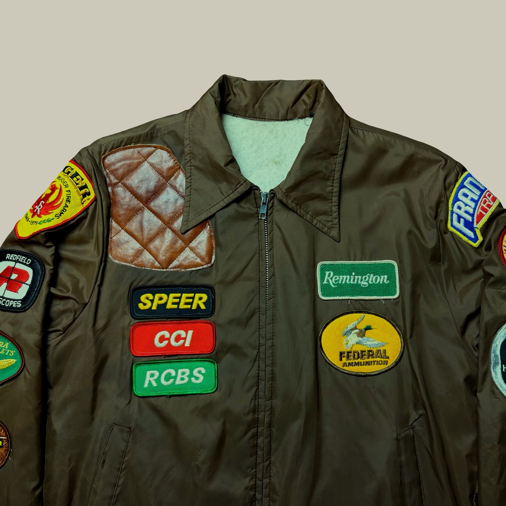 PATCHED FIREARMS & HUNTING WORK JACKET (C. LATE 1970s–1980s)